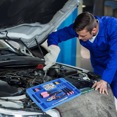 Mechanic using Blue Silicone Tool Tray For Auto Repairs Flexible Magnetic Tool Holder With Small Parts Tray on car engine