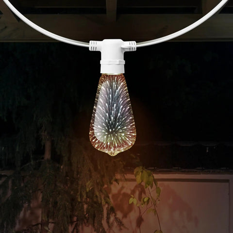 Infinity 3D Fireworks Multicolor LED Bulb for Party Vibes Prism ST19 Style LED Bulb hanging in garden setting