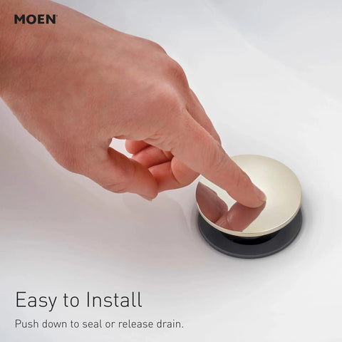 A hand pressing the chrome drain of Beric Chrome Modern One-Handle Single Hole Bathroom Faucet With Drain Assembly And Optional Deck Plate 84774.