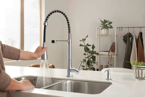 Precept Pull Down Kitchen Faucet With PowerInse Sprayer Chrome Finish 3 Function Spray in use over a modern kitchen sink