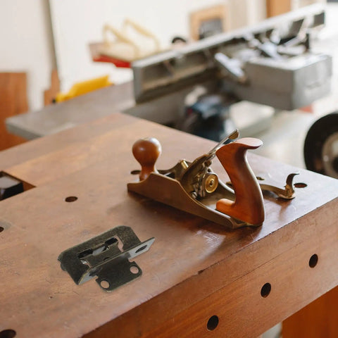 Wooden workbench with hand plane and Self Closing Cabinet Hinges One Half Inch Overlay, Semi Concealed Steel Hinges with screws.