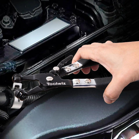 Close-up of hand using Toolwiz Clic-R plier from Four Piece Radiator Hose Clamp Pliers Set With Long Reach 27 Inch Wire Spring Flat Band Remover And Clic R Type Hand Tools For Automotive cooling Systems in engine bay