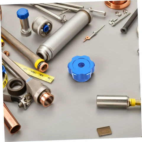 Blue Alloy Valve Stem Knob With 6mm Hole Replacement amidst plumbing tools on gray surface