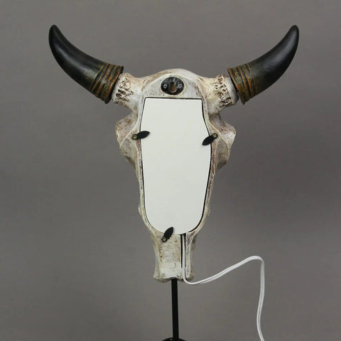 Back view of Southwestern Style Steer Skull Resin Wall Sconce Or Table Lamp with removable metal stand and LED bulb, rustic decor.