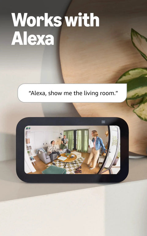 Sleek 360 Degree Pan Tilt Indoor Security Camera With Crisp Hd Video And Two Way Talk For Keeping Tabs On Your Space Plus Instant Smart App Alerts And Clean White Case For A Solid Setup You Know You Need Right Now in a living room setting monitoring a social interaction.