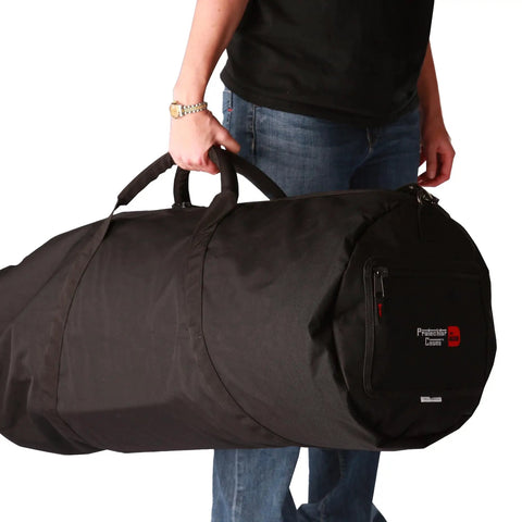 Built Tough Drum Hardware Carry Bag With Adjustable Shoulder Strap And Dual Grips, Heavy Duty 600 Denier nylon carried by a person.