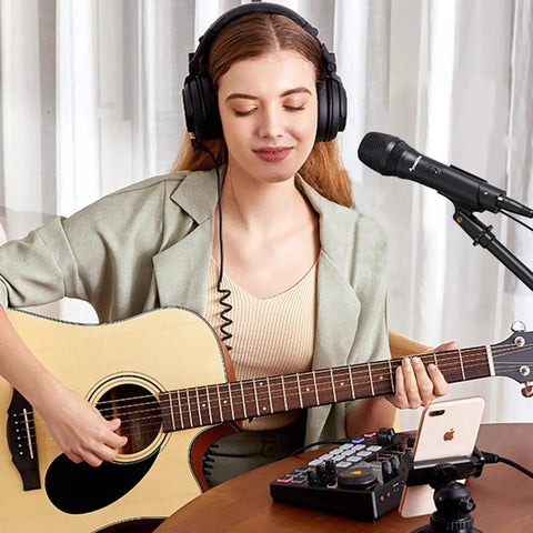 Woman playing guitar using Dual USB And XLR Dynamic Podcast Mic Kit With Volume Control Shock Mount And Pop Filter For Vocals Instruments Recording Voiceover And Live Streaming Right Now.
