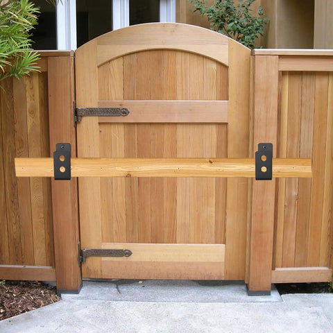 Built Tough Heavy Duty Door Barricade Brackets 8 Pack 2X4 Inch U Shaped Drop Open Bar Holders secured on wooden gate.