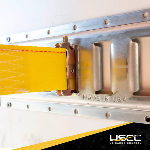Close-up of Beefy E Track Rail 5 Ft Galvanized 12 Gauge Steel in use with yellow strap for trailers, made in USA.