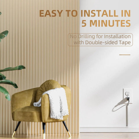 Effortless Wall Cable Hideaway Kit for TVs installed with self adhesive, keeping cords tidy beside a chair in a modern living room.