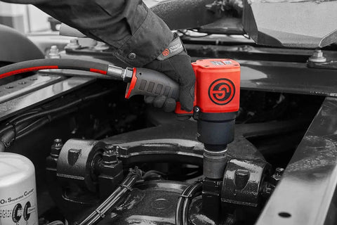 Shop Tested 3/4 Inch Air Impact Wrench pumping out 1400 Ft Lbs mean torque being used on a vehicle.