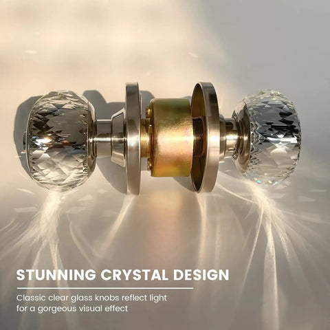 Satin nickel crystal glass door knob set with diamond cut, privacy lock, and keys, reflecting light for a modern look.