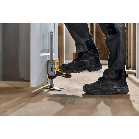 Heavy Duty Construction Jack With Slim Tapered Base For Quick Under Application Access And Boss Level Stability On Every Job Site Multi Color Rig Support Zero Hassle positioned near a doorway.