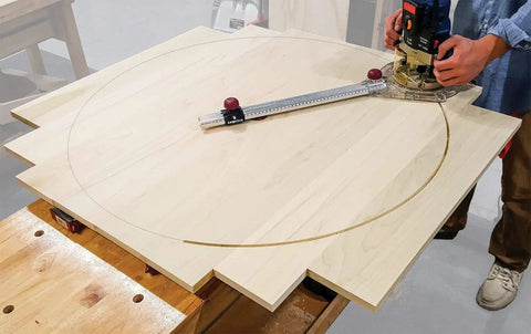 Adjustable Circle Cutting Guide Set Featuring Built Tough Metric And Imperial Scales For No Sweat Precision Cutting With Top Shelf Inside Outside Router Templates For Custom Woodworks, showing router cutting a circle on plywood.
