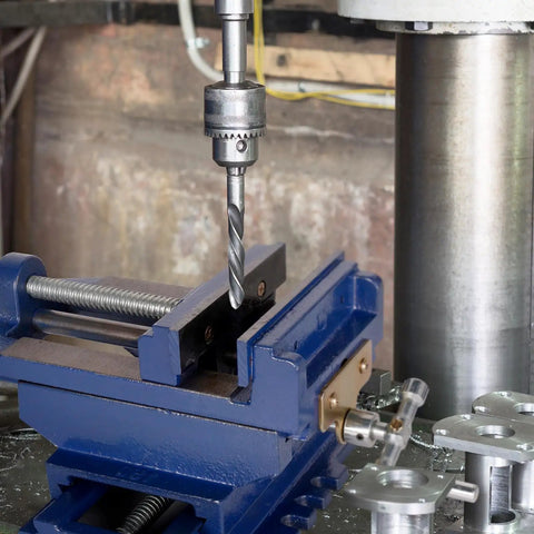 Badass Six Inch Cross Slide Drill Press Vise And Heavy Duty Bench Vice with drill bit in position for precision machining.