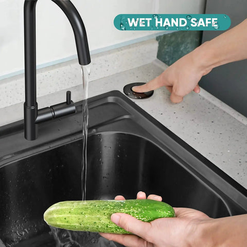 Person using Garbage Disposal Air Switch Kit With Sink Top Push Button For Waste Disposer Up To 2HP Safe With Wet Hands UL Certified Power Module Easy To Install Black Finish Quiet Reliable Kitchen Upgrade