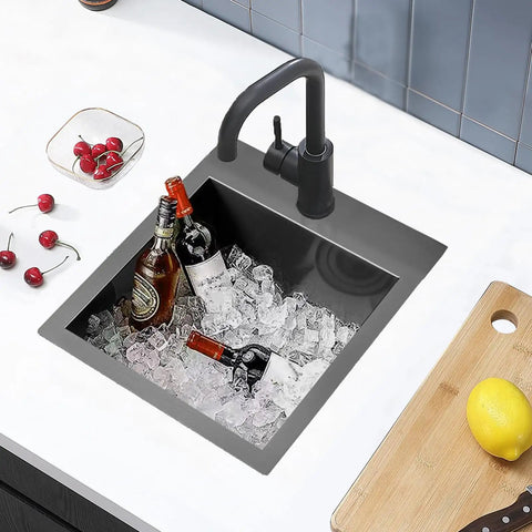 Single Bowl Undermount Bar Sink In Brushed Nickel 15 Inch By 15 Inch 18 Gauge 304 Stainless Steel With Satin Brushed Finish filled with ice and bottles.