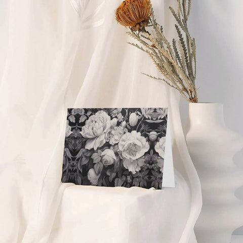 Floral Graphite Print Greeting Cards Half Fold 4x6 Inches displayed against white fabric with dried flowers.