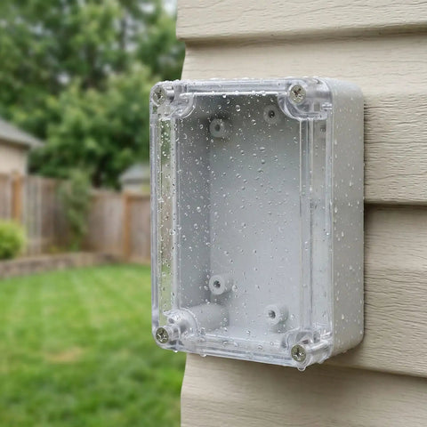 Premium 6 Pcs Weatherproof Electrical Box Enclosure Kit For Security Systems And Circuits with rain droplets on transparent cover.