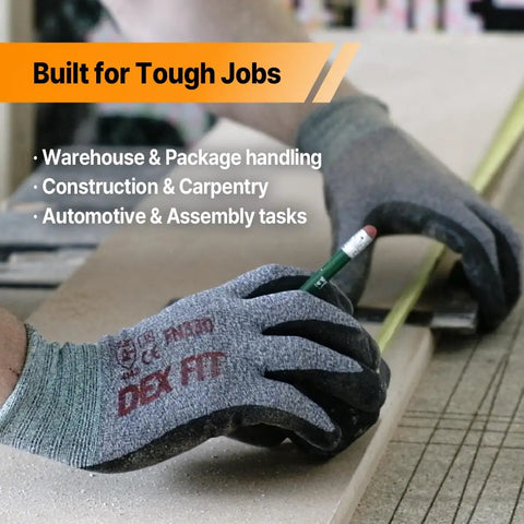 Person wearing Nitrile Work Gloves FN330 With All Day Comfort And 3D Stretch Fit, holding a pencil for precise grip and dexterity