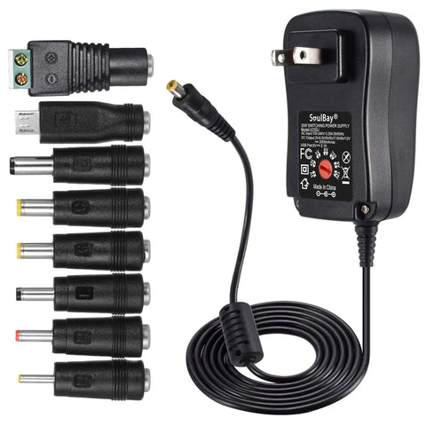 Universal 12V Power Supply Adapter with multiple plugs, adjustable outputs 3V-12V, 5V USB port for LED strip lights and devices.