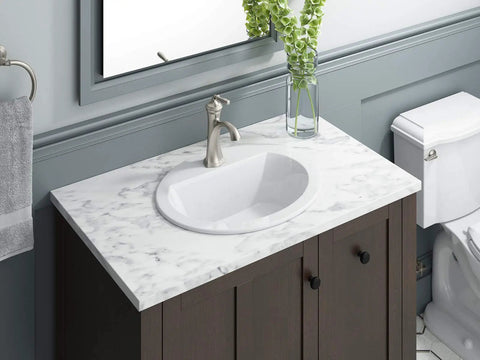 Bryant Oval Self-Rimming Bathroom Sink With Single-Hole Faucet Drilling White Vitreous China 20-Inch By 16.5-Inch Vanity Lavatory in bathroom setting
