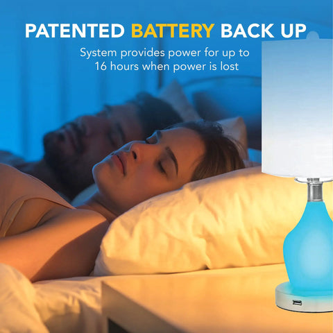 Emergency Battery Back Up Table Lamp With USB Charging And Color Changing Base in bedroom setting, lit with blue light