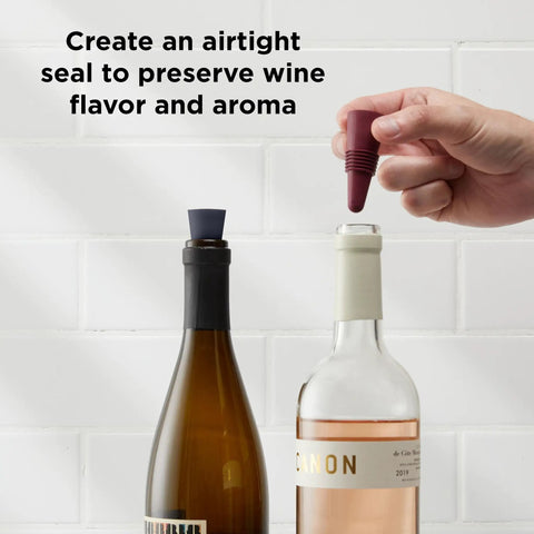 Preserve Your Opened Bottles With This Game Changing Set Of Four Multicolor Wine Stoppers sealing opened wine bottles.