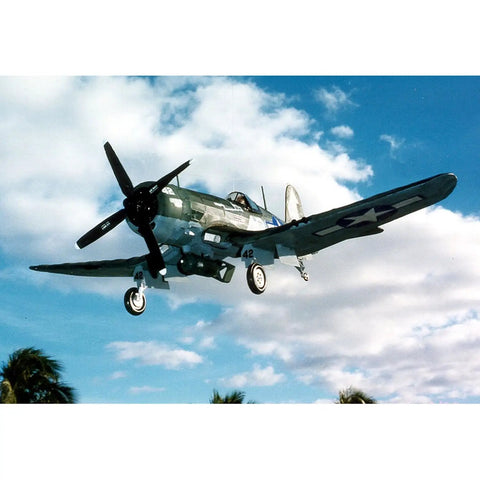 Vought F4U-4 Corsair Model Kit Navy Edition flying against a blue sky background