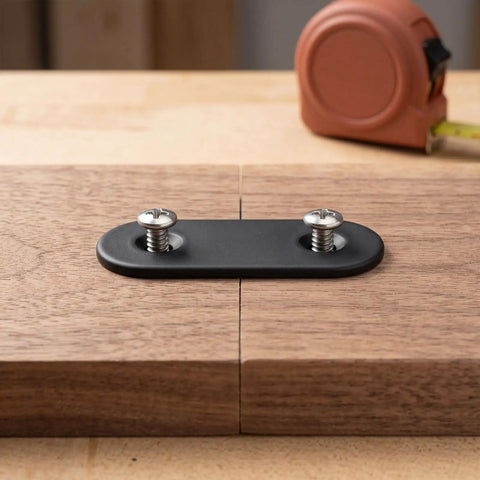 30-Pack Black Stainless Steel Flat Brace Brackets For Wood And Metal, 2.36 X 0.63 Inch Mending Plates With Screws shown on wood surface