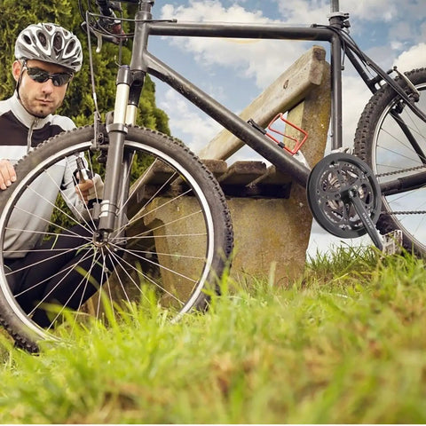 Cyclist with mountain bike featuring Beefed Up Heavy Duty 170mm 52T Square Taper Crankset With Double Chain Guard.