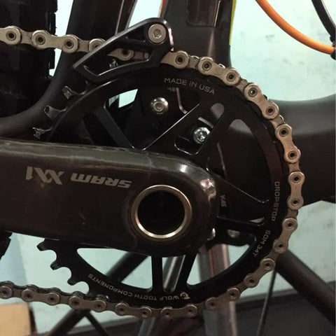 Close-up of SRAM XX1 crankset with Chain Guide For 30-40T Narrow Wide Chainring Direct Mount Guard ISCG 03 Aluminum Beefy No Drop Bike Accessory