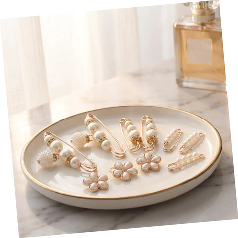 Eight Piece Pearl Waist Tightener Pin Set Elegant Alloy Dress Cincher Clips on a decorative plate with a soft background.
