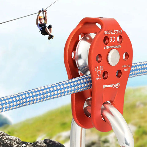 Built Tough Climbing Pulley With Fixed Plate Anodized Aluminum Alloy Sheave For Heavy Duty Rescue Climbing Hauling Zipline Rigging And Rappelling 26KN Max Load Compact Badass Gear Black close-up with rope