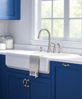 Top Shelf High Arc Kitchen Faucet With Spot Resist Stainless Finish And Smooth One Handle Design To Make Kitchen Chores An Absolute Breeze On Your Counter over farmhouse sink with blue cabinetry.