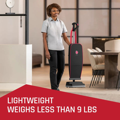 Person using Hoover Commercial Superior Lite Upright Vacuum Cleaner Lightweight at Nine Pounds With Forty Foot Cord For Deep Carpet Cleaning And Powering Through Toughest Messes In Offices Or Small Shops Easy Maneuvering Design.
