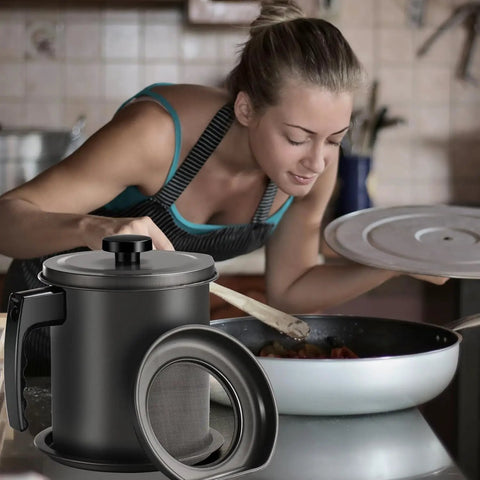 Sizzlin Bacon Grease Catcher With Fine Mesh Filter Seven Cup Heavy Duty Iron Fat Jar on kitchen counter with a woman cooking.