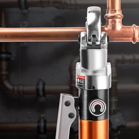 Heavy Duty Hydraulic Pipe Crimping Tool With 1/2 3/4 And 1 Inch Jaws For Copper Tube Fittings against copper pipes, showcasing functionality.