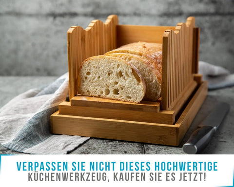 No Mess Bamboo Bread Slicer For Homemade Loaves Adjustable Foldable Bread Cutter With Crumble Tray showing sliced bread
