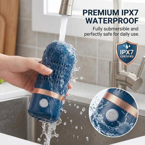 Person holding IPX7 waterproof Cordless OH Ion Purifier Produce Cleaner under running water