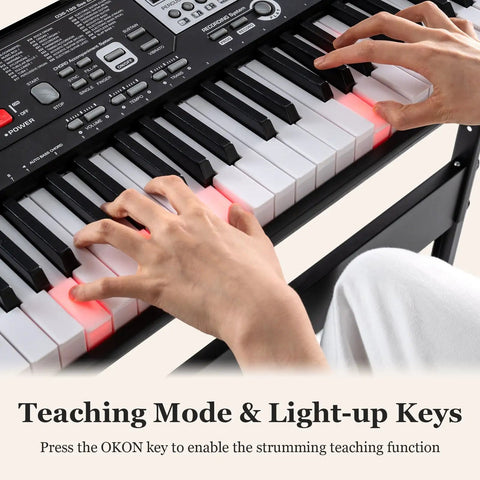 Hands playing 61 Key Portable Keyboard Piano With Stand And Bench Lighted Keys with teaching mode and illuminated keys