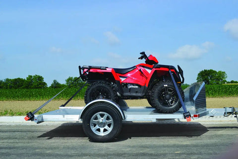 G3 Retractable Ratchet Tie-Downs 2x72 Pair Orange And Black Heavy Duty Cargo Straps securing ATV on trailer