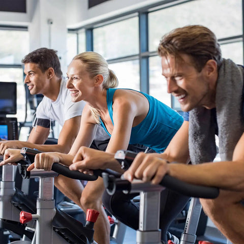 People using stationary bikes with 2 Pairs Adjustable Exercise Bike Pedal Straps For Stationary Bikes Universal Fit Rubber No Slip Foot Straps For Home Gym Durable Comfort And Secure Grip To Boost Your Workout Performance