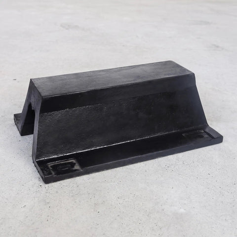 Rugged Rubber Bolt Down Dock Protection For Marinas and Piers Keeps Your Boats Safe From Impacts With Easy Secure Install No Fuss, Shock Absorbing Dock Bumper For Waterfront Use in black rubber material on a concrete surface