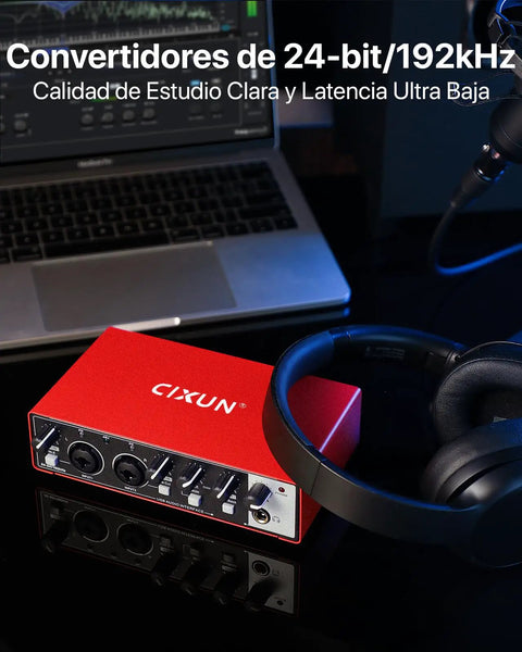 Matte red 2x2 USB C audio interface for PC and Mac next to laptop and headphones, plug and play, 24-bit 192kHz recording.