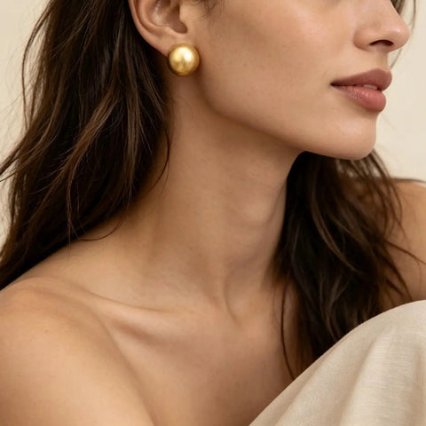 Bold Gold Round Earrings For Women Featuring A Chunky Wide Half Ball Design Lightweight Studs For Everyday Wear Dope Party Ready Glam Vibe Trendy Circle Hoop Look Essential Accessory For Chic Street Style gold round stud earrings on model