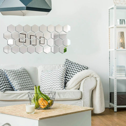 Living room with 32 Pcs Hexagon Mirror Wall Decals Removable Silver Acrylic Honeycomb Design for DIY Home Art above sofa.