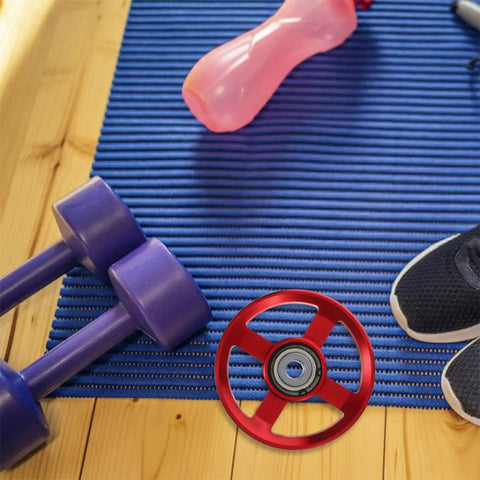 2 Pack Aluminum Cable Pulley Wheel For Weight Lifting Equipment on a gym mat with dumbbells and shoes