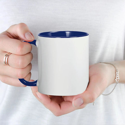 Hand holding a Premium Ceramic Coffee Mug 11 Oz Featuring Fastest Cart Graphic Art, white with blue handle, ideal for home or office.