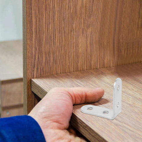 Hand installing 16Pc L Shaped Corner Brackets For Cabinets And Tables Right Angle Joints Cold Rolled Steel Furniture Connectors